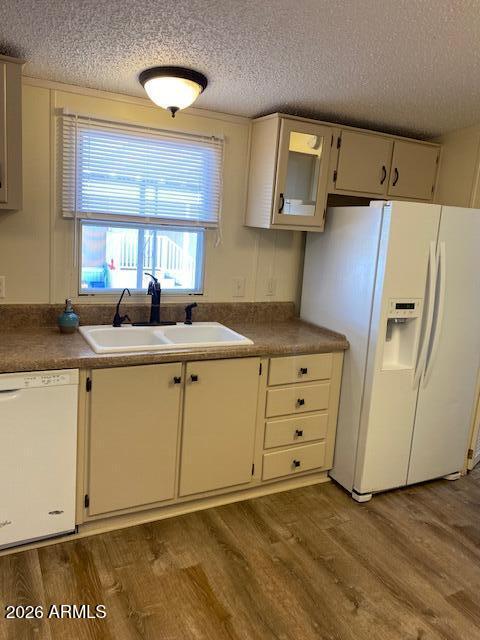 301 South Signal Butte Road, Unit 1124 Apache Junction, AZ 85120 - Photo 15 of 41 a kitchen with granite countertop a sink cabinets and stainless steel appliances