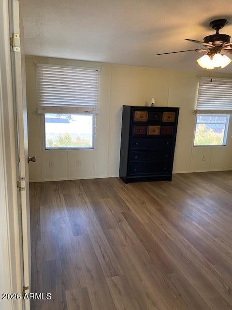 301 South Signal Butte Road, Unit 1124 Apache Junction, AZ 85120 - Photo 18 of 41 an empty room with wooden floor and windows