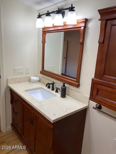 301 South Signal Butte Road, Unit 1124 Apache Junction, AZ 85120 - Photo 24 of 41 a bathroom with a sink vanity and a mirror