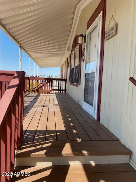301 South Signal Butte Road, Unit 1124 Apache Junction, AZ 85120 - Photo 3 of 41 a view of balcony with wooden floor
