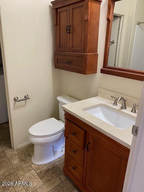 301 South Signal Butte Road, Unit 1124 Apache Junction, AZ 85120 - Photo 32 of 41 a bathroom with a sink and a toilet