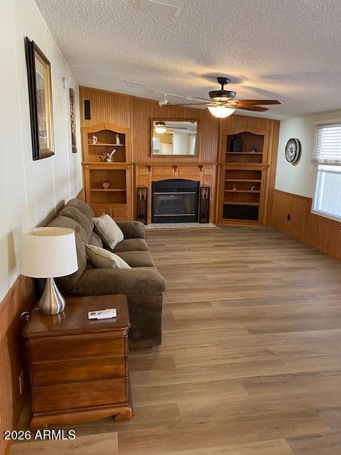 301 South Signal Butte Road, Unit 1124 Apache Junction, AZ 85120 - Photo 9 of 41 a living room with furniture and a flat screen tv