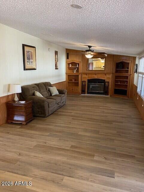 301 South Signal Butte Road, Unit 1124 Apache Junction, AZ 85120 - Photo 10 of 41 a living room with furniture and a fireplace