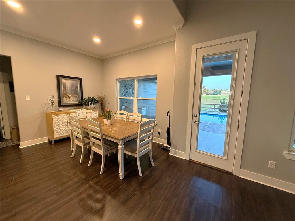928 Azalea Drive Franklin, TX 77856 - Photo 12 of 37 a dining room with furniture and wooden floor