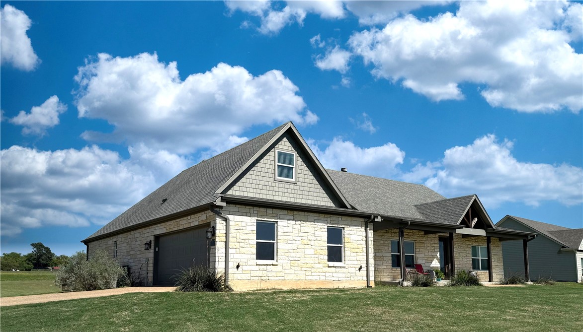 928 Azalea Drive Franklin, TX 77856 - Photo 2 of 37 a view of a house with a yard