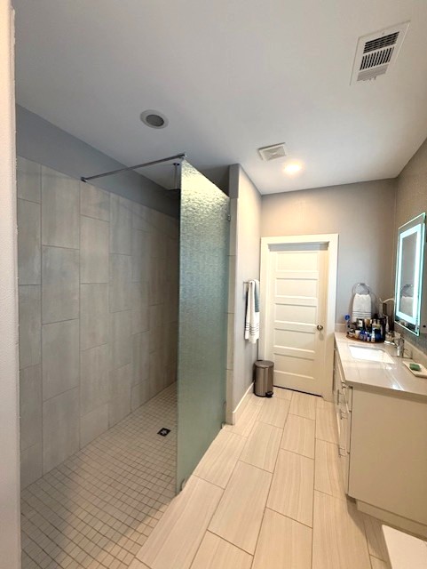 928 Azalea Drive Franklin, TX 77856 - Photo 22 of 37 a bathroom with a sink a toilet and shower