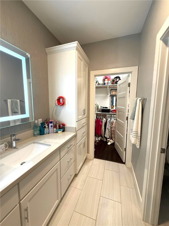 928 Azalea Drive Franklin, TX 77856 - Photo 23 of 37 a kitchen with a sink and wooden floor