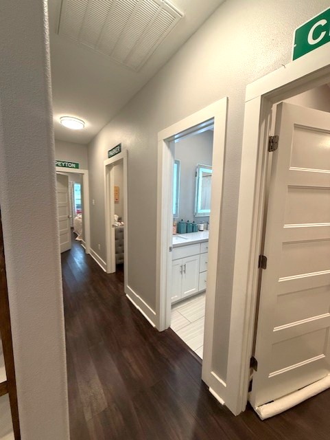 928 Azalea Drive Franklin, TX 77856 - Photo 25 of 37 a view of a hallway with wooden floor