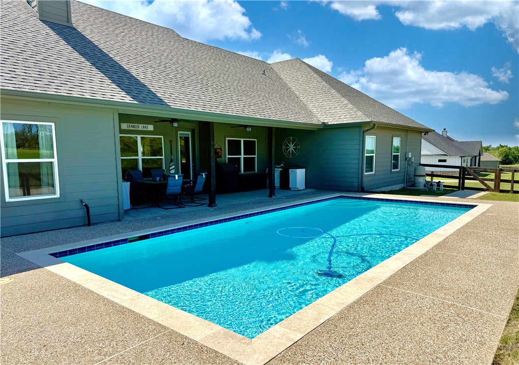 928 Azalea Drive Franklin, TX 77856 - Photo 4 of 37 a view of a house with a backyard porch and sitting area