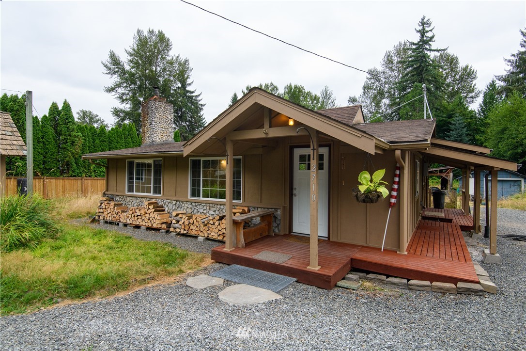2710 Callow Road Lake Stevens, WA 98258 - Photo 1 of 37 a front view of a house with garden