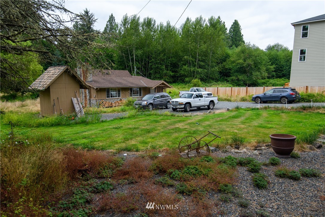 2710 Callow Road Lake Stevens, WA 98258 - Photo 11 of 37 a view of a house with backyard sitting area and garden