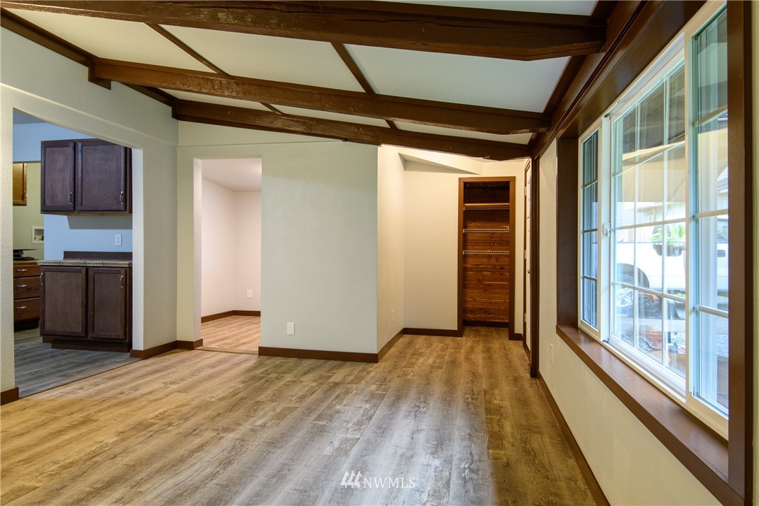 2710 Callow Road Lake Stevens, WA 98258 - Photo 18 of 37 a view of a hallway with wooden floor and a kitchen