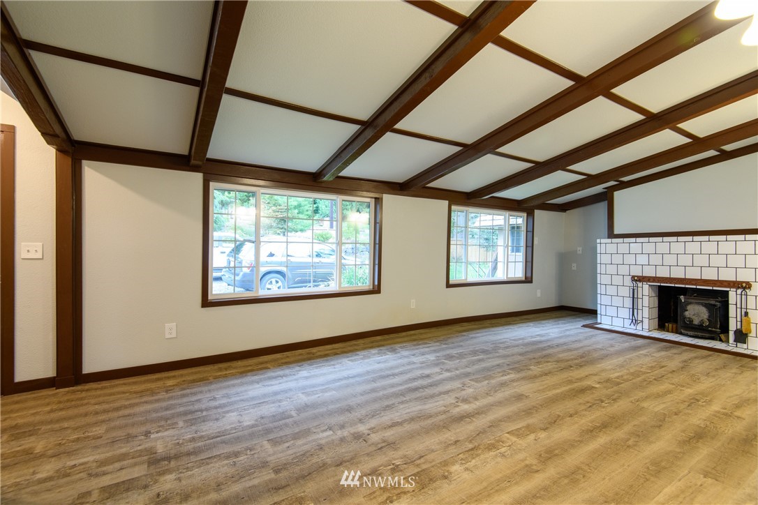 2710 Callow Road Lake Stevens, WA 98258 - Photo 20 of 37 a view of empty room with floor to ceiling window and fireplace