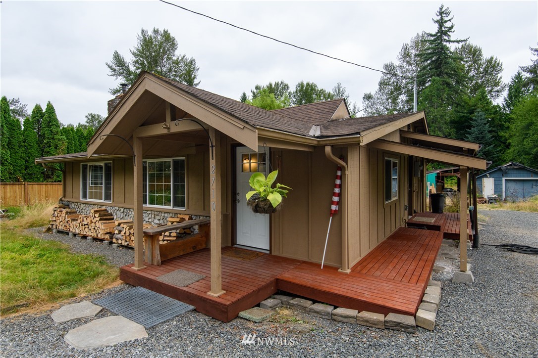 2710 Callow Road Lake Stevens, WA 98258 - Photo 3 of 37 a front view of house with a garden and patio