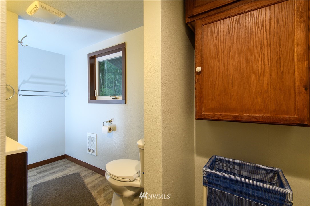 2710 Callow Road Lake Stevens, WA 98258 - Photo 26 of 37 a bathroom with a toilet a sink and a shower curtain