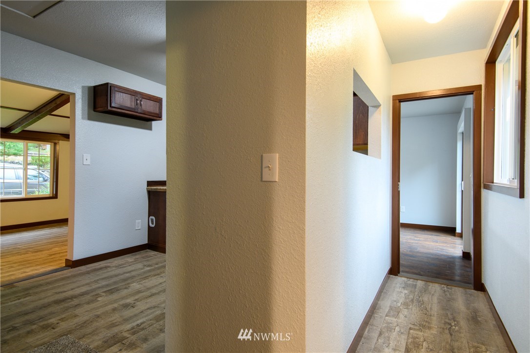 2710 Callow Road Lake Stevens, WA 98258 - Photo 28 of 37 a view of hallway with a door and wooden floor