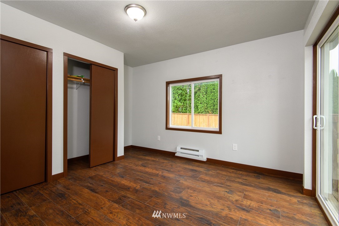 2710 Callow Road Lake Stevens, WA 98258 - Photo 31 of 37 an empty room with wooden floor and windows