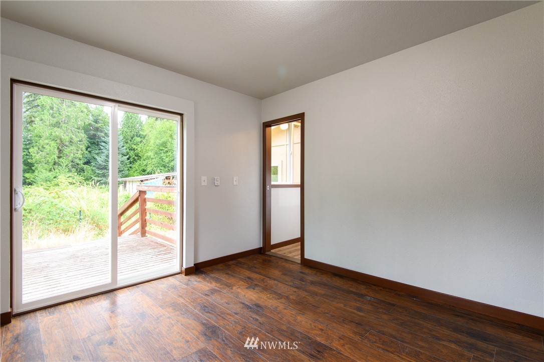 2710 Callow Road Lake Stevens, WA 98258 - Photo 32 of 37 an empty room with wooden floor and windows
