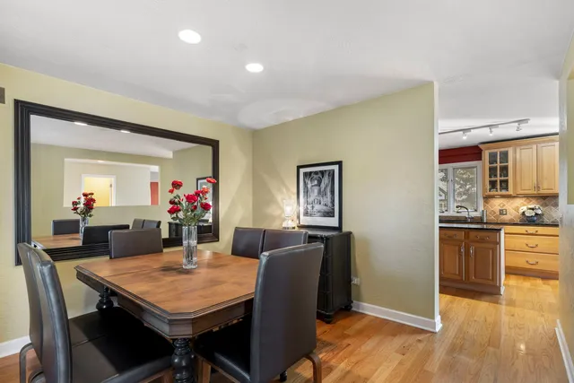 a view of a dining room with furniture and wooden floor