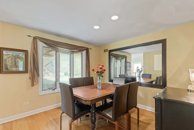 a view of a dining room with furniture and window