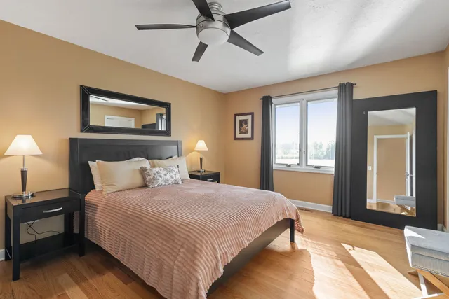 a bedroom with a bed and a window