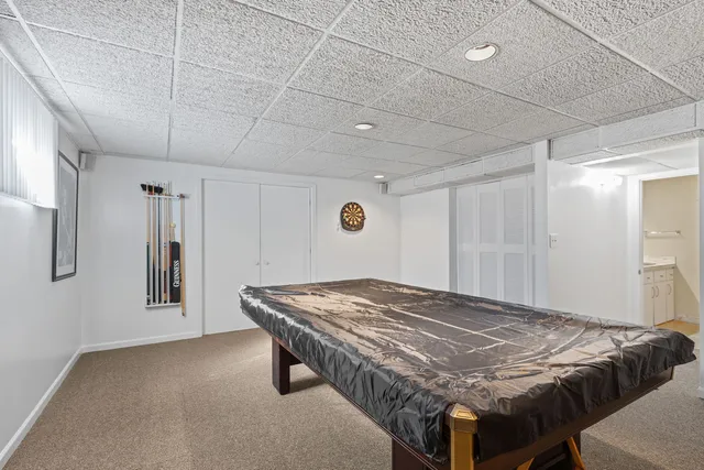 a bedroom with a bed and a table