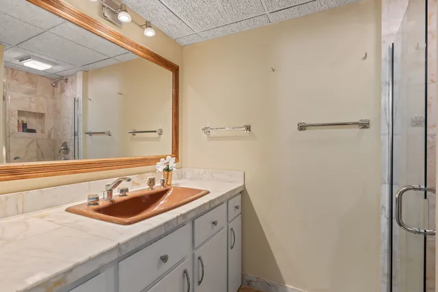 a bathroom with a sink and a mirror