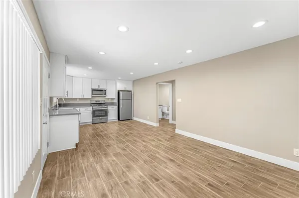 a view of kitchen with wooden floor