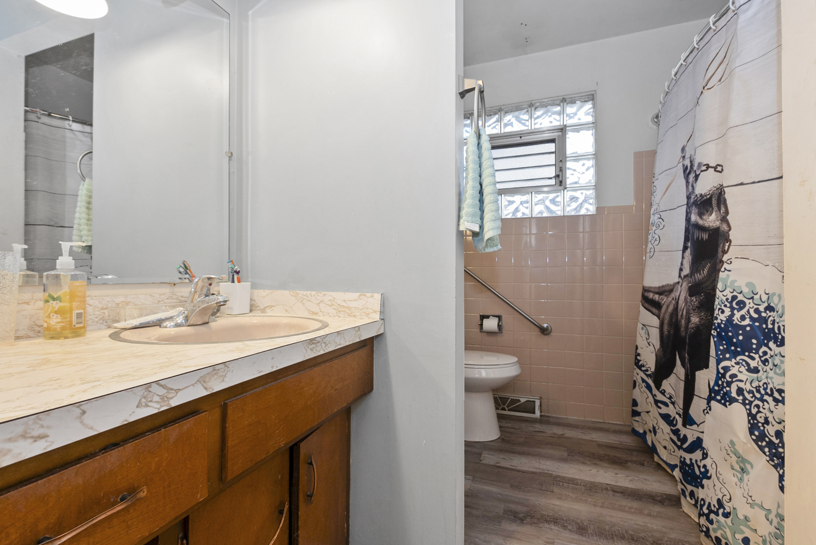 4511 West Howdy Lane Alsip, IL 60803 - Photo 14 of 17 a bathroom with a sink a toilet and shower
