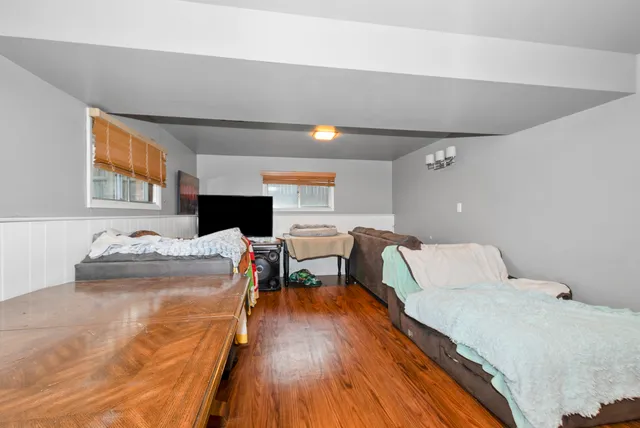 a bedroom with a bed and a table