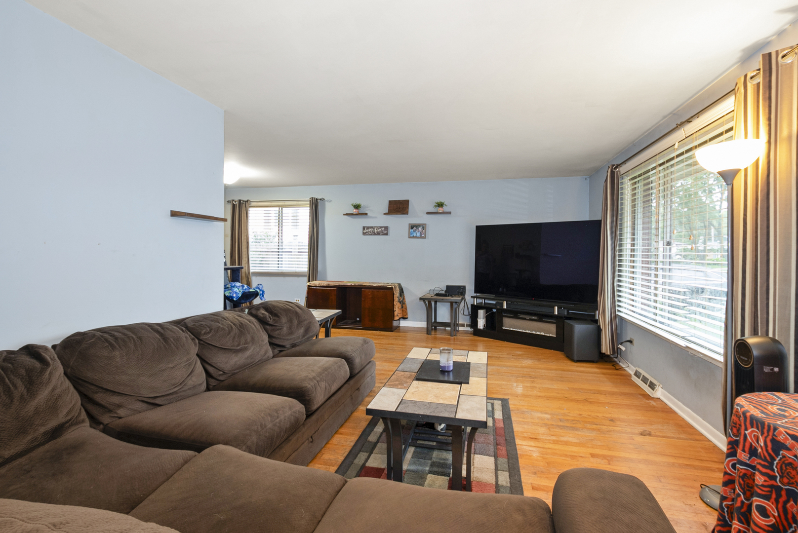 4511 West Howdy Lane Alsip, IL 60803 - Photo 7 of 17 a living room with furniture and a flat screen tv