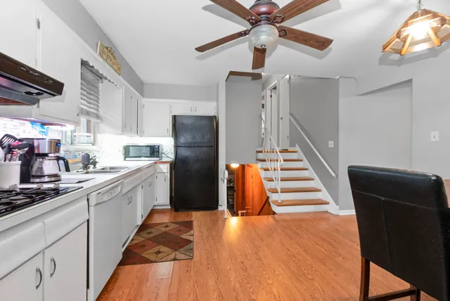 a kitchen with stainless steel appliances a refrigerator and a stove