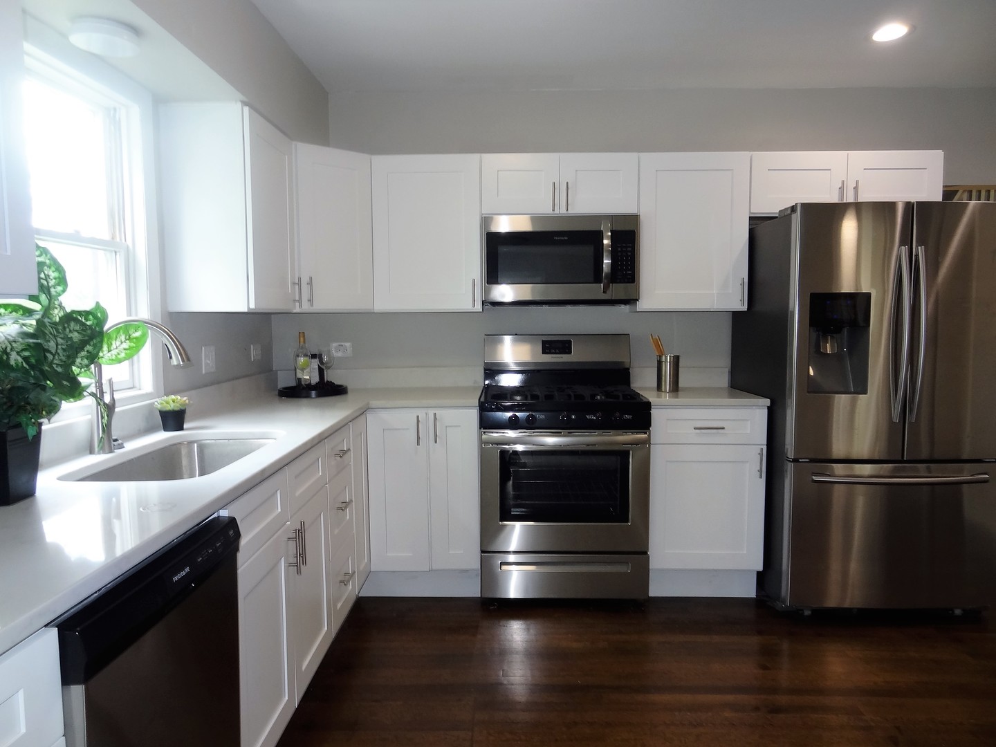 3331 Flossmoor Road Flossmoor, IL 60422 - Photo 19 of 29 a kitchen with stainless steel appliances a sink dishwasher a refrigerator a microwave a sink and cabinets