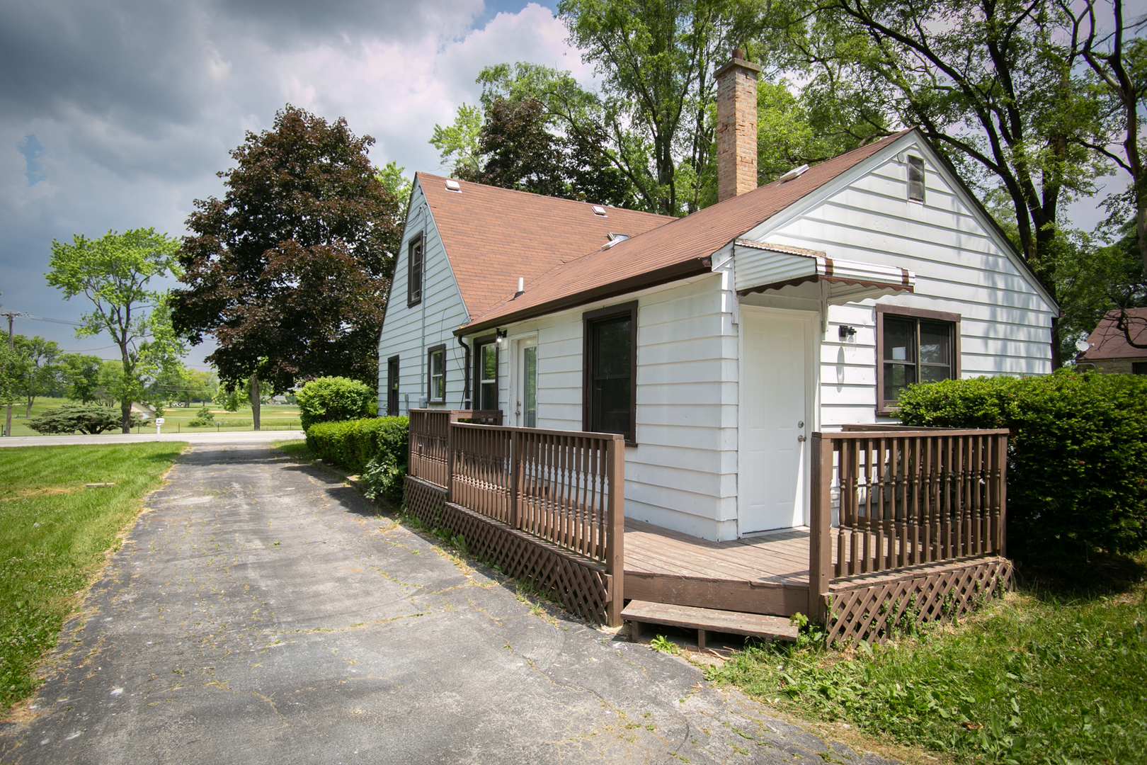 3331 Flossmoor Road Flossmoor, IL 60422 - Photo 5 of 29 a view of a small house with a yard and plants