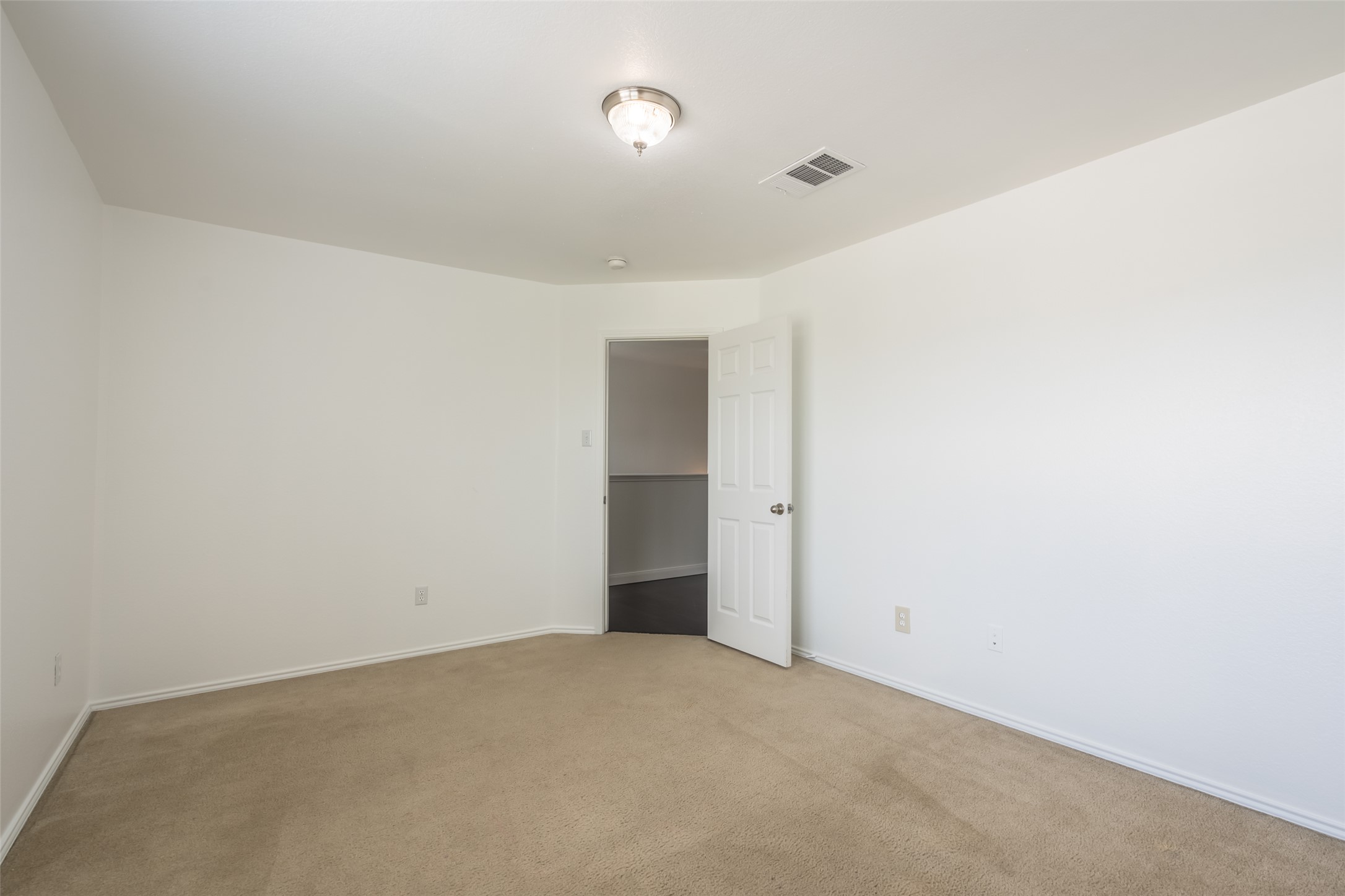 1013 Ranchero Road Leander, TX 78641 - Photo 22 of 30 Crisp walls and plush carpeting define this versatile secondary bedroom space.