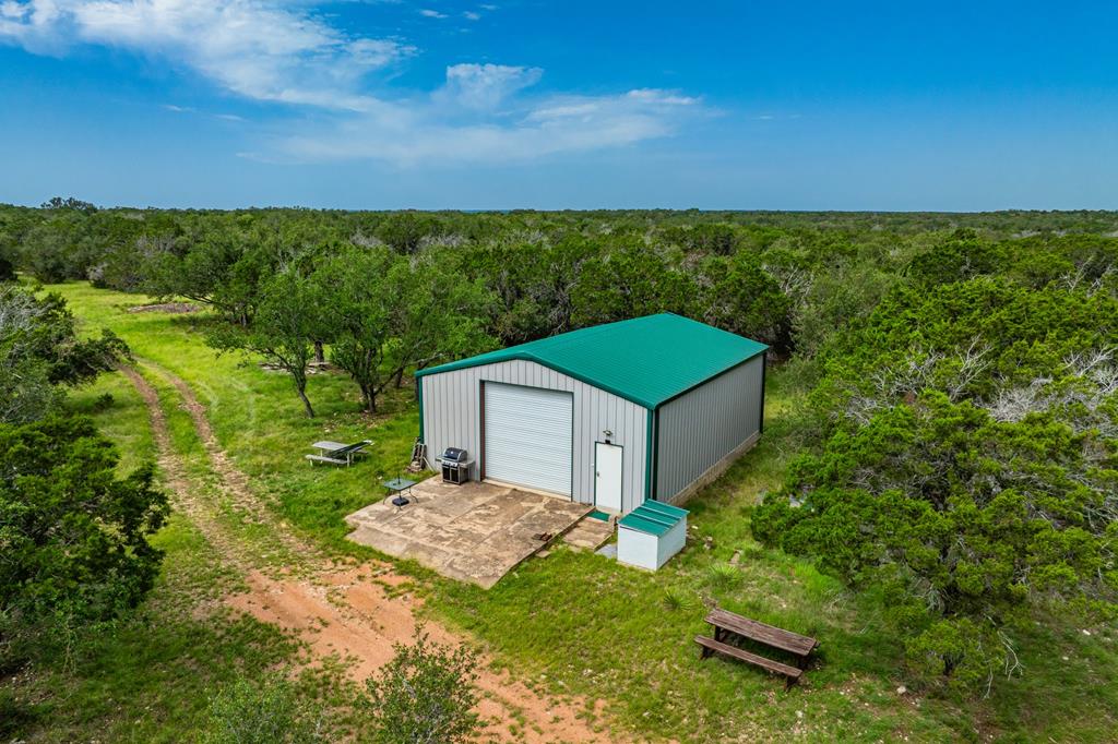 229 Lost Man Road Northwest Junction, TX 76849 - Photo 1 of 32 a view of a backyard with a garden