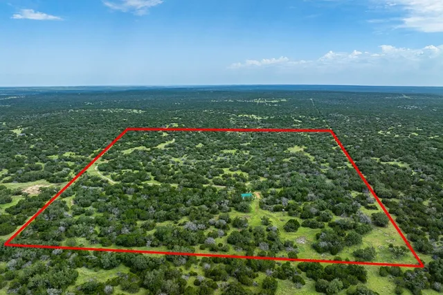 a view of a swimming pool and a yard