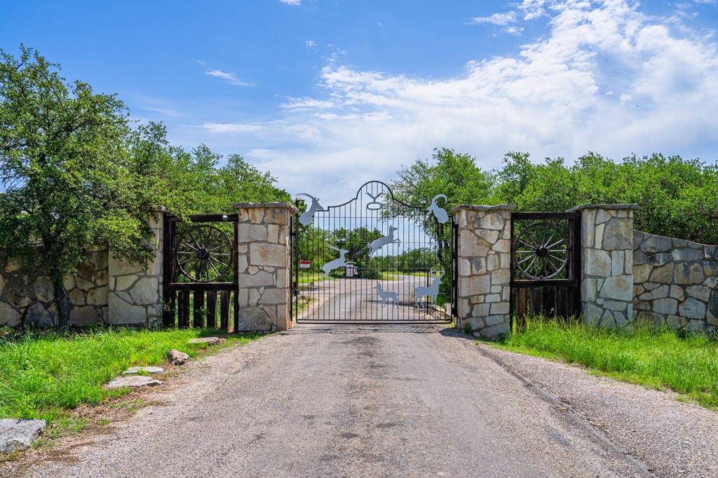 229 Lost Man Road Northwest Junction, TX 76849 - Photo 29 of 32 a front view of a house with a yard and table and chairs