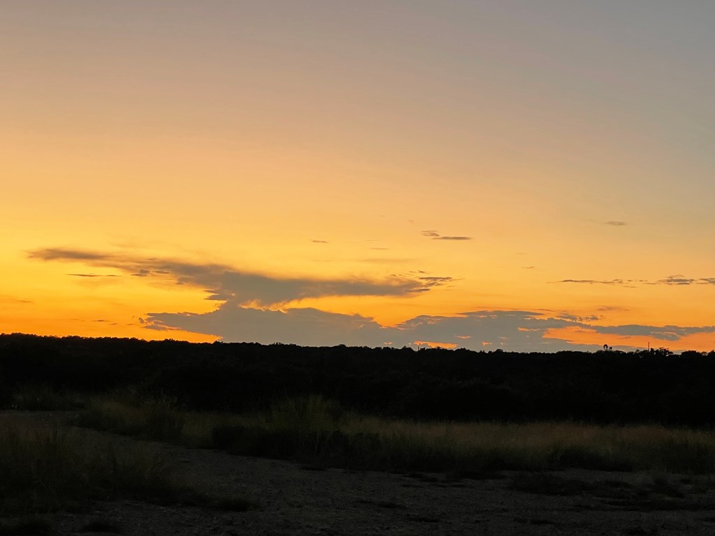 229 Lost Man Road Northwest Junction, TX 76849 - Photo 30 of 32 a view of an ocean with a mountain
