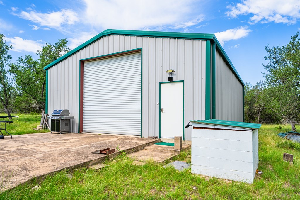 229 Lost Man Road Northwest Junction, TX 76849 - Photo 3 of 32 a front view of a house with garden