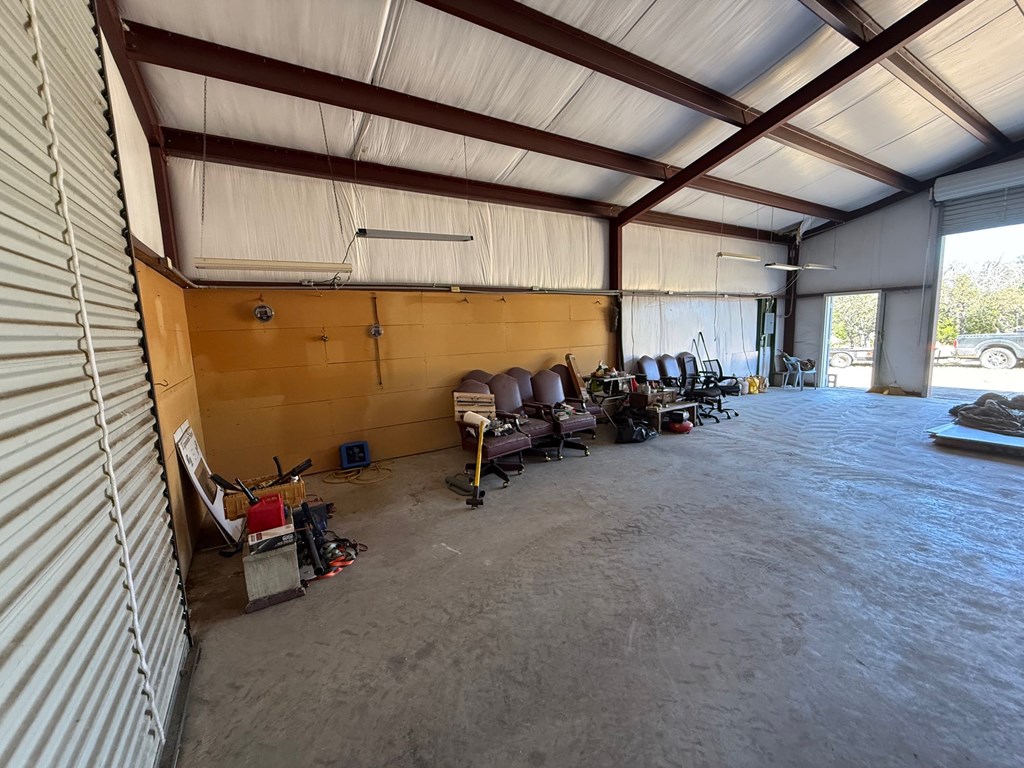 229 Lost Man Road Northwest Junction, TX 76849 - Photo 5 of 32 a view of a room with gym equipment