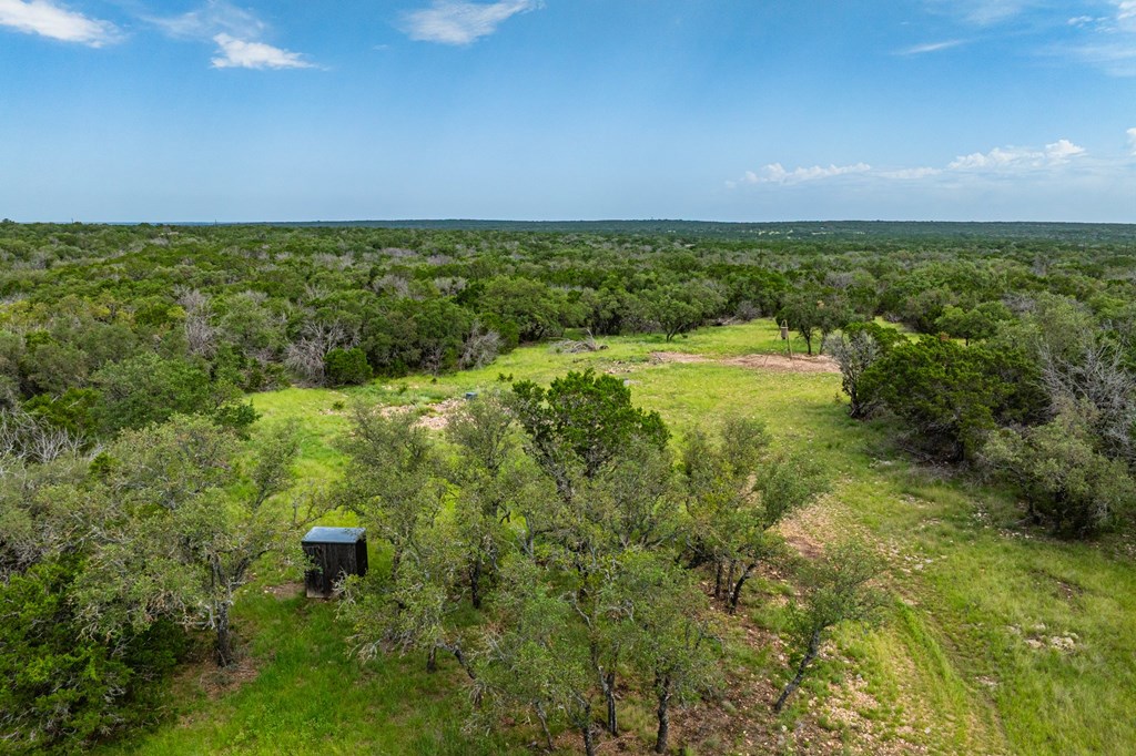 229 Lost Man Road Northwest Junction, TX 76849 - Photo 9 of 32 a view of a yard with an outdoor space