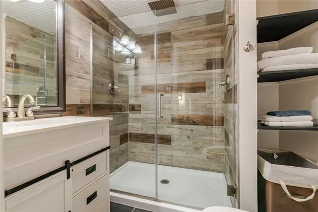 a bathroom with a shower and a sink