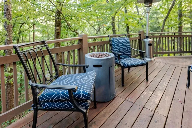 a view of a deck with furniture and wooden floor