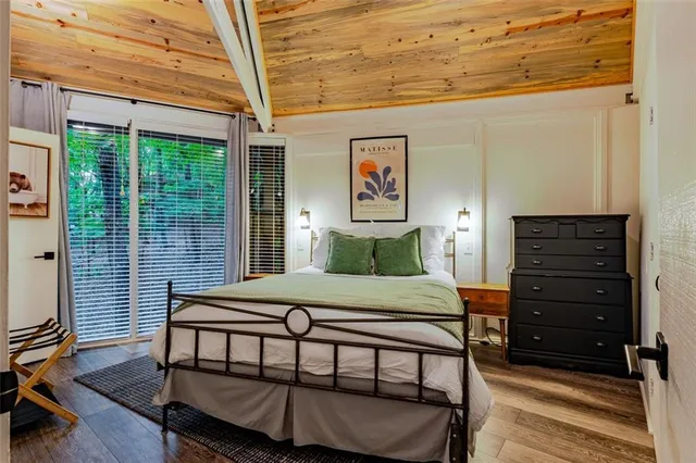 a bedroom with a bed and a table