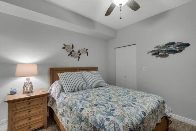 a bedroom with a bed and a lamp