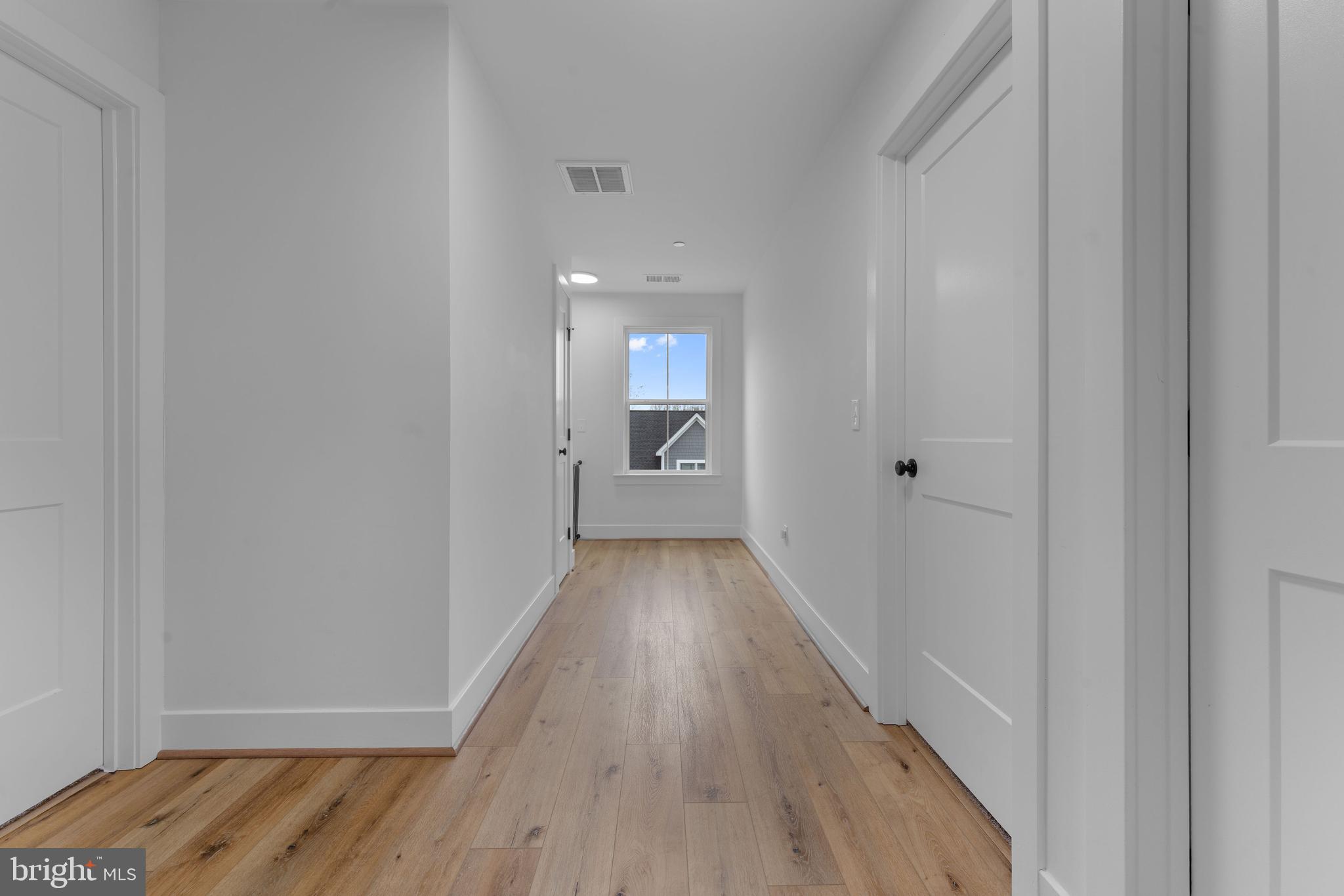 620 Doyle Road Deale, MD 20751 - Photo 23 of 36 Upper level hallway w/ natural light and a view!