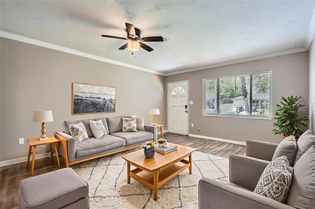 a living room with furniture and a window