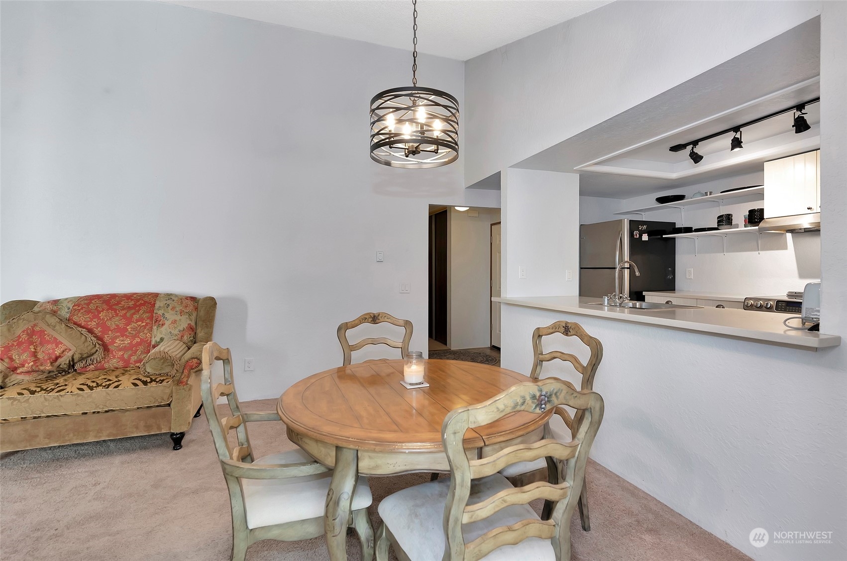 14401 Southeast Petrovitsky Road, Unit E205 Renton, WA 98058 - Photo 13 of 28 a view of a dining room with furniture