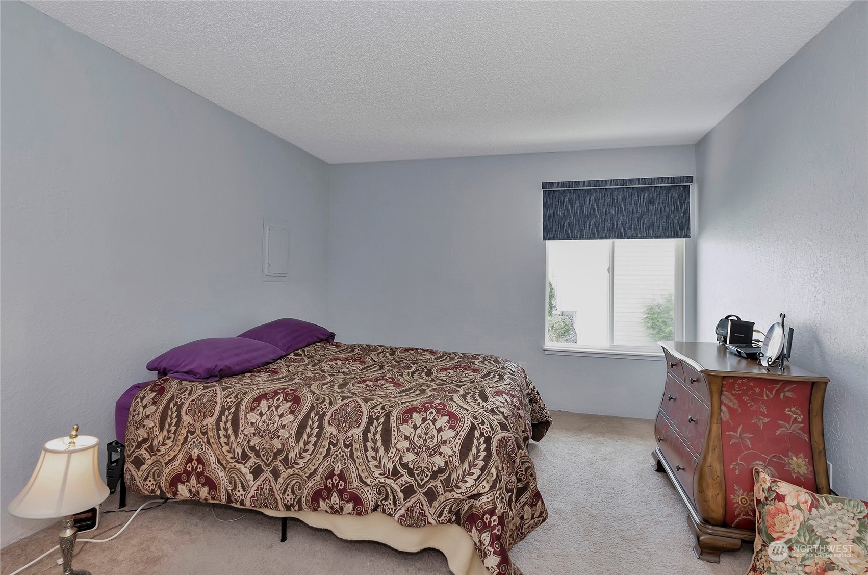 14401 Southeast Petrovitsky Road, Unit E205 Renton, WA 98058 - Photo 16 of 28 a bedroom with a bed and window